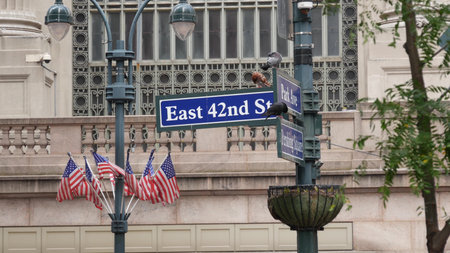 New York City Grand Central Terminal, 42 street, Park Avenue, Pershing Square architecture. Midtown district railroad hub, railway transport. NY crossroad corner, intersection road sign, american flagの写真素材