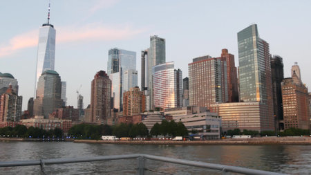 New York City skyline from ferry boat to Staten Island. Manhattan downtown. World Trade Center skyscraper from ferryboat. River waterfront sunset panorama, riverfront buildings architecture, FiDi, USAの写真素材