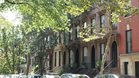 New York City townhouse building, Brooklyn Heights residential district, USA. Brownstone urban...
