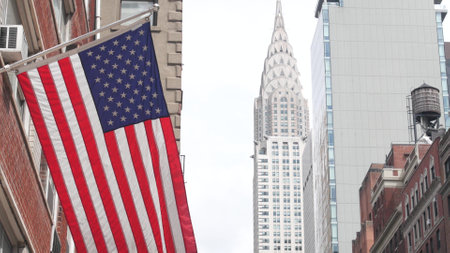 New York, american flag. Chrysler building. Manhattan midtown city street, Lexington Lex Avenue. Symbol of freedom, democracy, liberty and patriotism. Star-Spangled Banner. Stars, Stripes. Water towerの写真素材