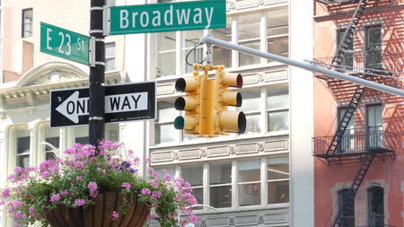 Broadway street road sign, Manhattan midtown architecture, New York City corner. Yellow traffic...