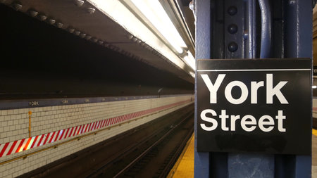 New York City empty subway station interior, underground metropolitan platform sign. Metro railway...