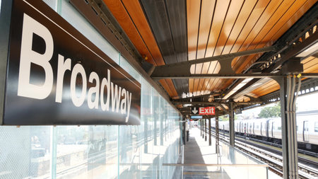 New York subway station Broadway text sign. Metropolitan train on platform, United States public...