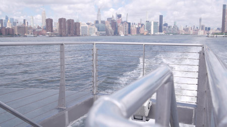 New York City skyline from ferry boat. Manhattan midtown highrise skyscrapers from ferryboat. East...