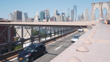 Cars on Brooklyn Bridge to Dumbo. New York City Manhattan downtown skyline, financial district...