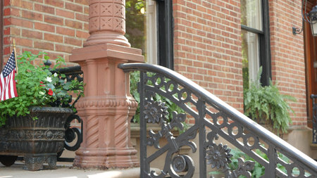 New York City townhouse building, Brooklyn Heights residential district, USA. Brownstone urban...