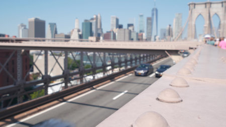 Cars on Brooklyn Bridge to Dumbo. New York City Manhattan downtown skyline, financial district cityscape. World Trade Center, WTC skyscraper. Road traffic and architecture. Iconic landmark, travel USAの写真素材