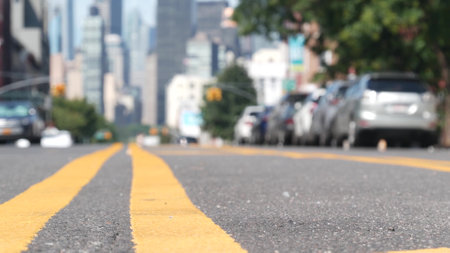 New York City skyline, Manhattan Midtown cityscape. High-rise skyscrapers from Queens, Long Island, Hunters Point, USA. Taxi on street, yellow dividing line, road marking. United States architecture.の写真素材