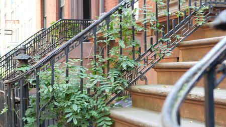 New York City townhouse building, Brooklyn Heights residential district, USA. Brownstone urban...