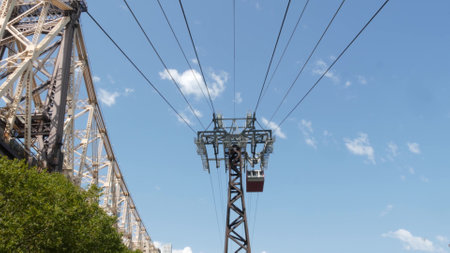 New York City Roosevelt Island tramway to Manhattan Midtown. American aerial cable tram near Queensboro Bridge. Urban public passenger transport, USA. Transportation and architecture in United States.の写真素材