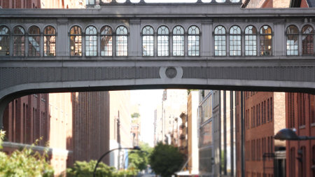 New York City street, Chelsea Market skybridge. Retro industrial architecture, red brick building....