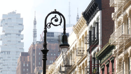 New York City Manhattan Soho fashion district near Broadway street. USA urban building facade, old american architecture. Shopping in NYC, United States. Business and residential real estate. Lanternの写真素材