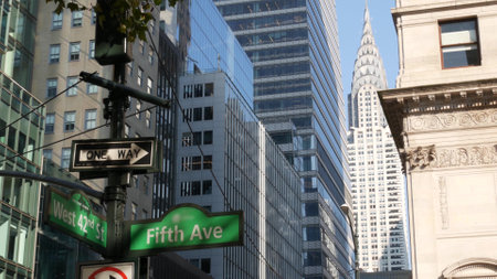 Fifth avenue, 5 ave road sign, Manhattan midtown highrise skyscraper architecture, New York City 5th av, 42 street corner near Bryant Park, Library. Traffic crossroad signage, USA. Chrysler Building.の写真素材