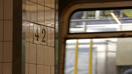 New York City subway station interior, underground metropolitan platform sign. Metro railway passenger train, public transport, United States. Text signboard 42 st. Grand Central Terminal, Manhattan.の写真素材