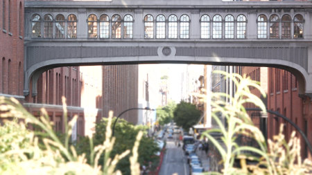 New York City street, Chelsea Market skybridge. Retro industrial architecture, red brick building. American old historic elevated sky bridge Manhattan landmark, USA. Meatpacking district, High Line.の写真素材