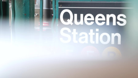 New York subway sign, Queens underground metro station. Metropolitan entrance fence, public transport exit. Long Island city street, NYC United States. Navigation text on signboard. Passenger guidanceの写真素材