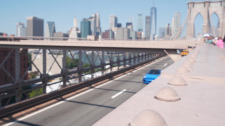Cars on Brooklyn Bridge. New York City Manhattan downtown skyline, financial district cityscape...