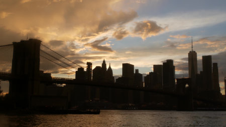 Brooklyn Bridge, rainy foggy day. New York City Manhattan downtown skyline architecture, financial district cityscape, United States. World Trade Center skyscraper. Autumn Pebble Beach in Dumbo, USA.の写真素材