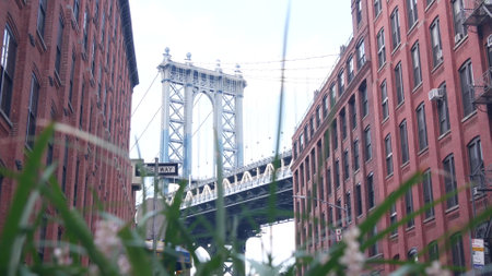 New York City Manhattan Bridge in Dumbo, Brooklyn. Red brick building on Washington street near...