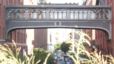 New York City street, Chelsea Market skybridge. Retro industrial architecture, red brick building. American old historic elevated sky bridge Manhattan landmark, USA. Meatpacking district, High Line.の写真素材