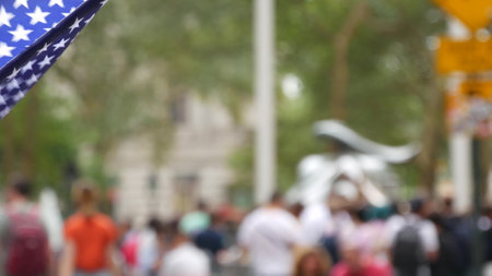 New York City Charging Bull, Wall street Stock Exchange symbol in USA. Lower Manhattan Downtown Financial District, United States. American Flag on Broadway street. Defocused tourist people. Landmark.のeditorial素材