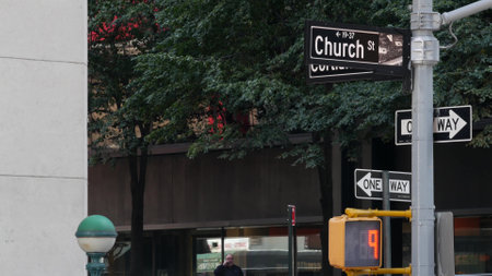 New York City crossroad, Church street intersection, one way road sign. Manhattan downtown, United States. Corner roadsign. NYC subway globe, metro entrance orb lamp. Pedestrian traffic light.の写真素材