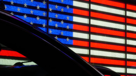 New York City Times Square, Manhattan Midtown Broadway street, USA. American flag, NYC urban life. People pedestrians silhouettes, cars dark contrast shadows.の写真素材