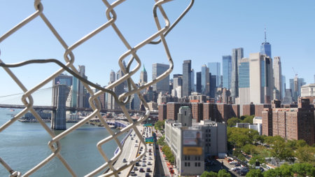 Brooklyn Bridge from Manhattan Bridge. New York City downtown skyline, financial district cityscape,...