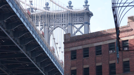 New York City Manhattan Bridge in Dumbo, Brooklyn. Red brick building on Plymouth street near Water street Archway. Under classic NYC industrial architecture. Below United States tourist landmark.の写真素材