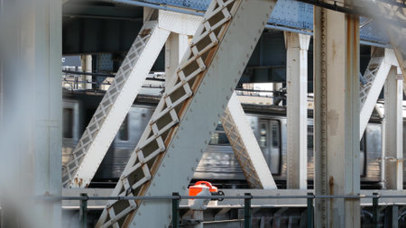 New York City Manhattan Bridge to Brooklyn Dumbo. American subway metro train from pedestrian path....