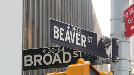 New York City, United States. Manhattan Downtown Financial District. American Wall street. Broad and Beaver corner road sign. Stock Exchange, USA Stock Market. Traffic light on crossroad intersection.の写真素材