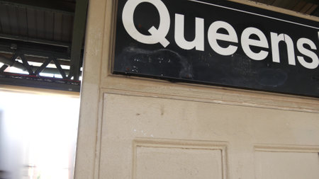 New York City subway station interior, underground metropolitan platform sign. Metro train, railway passenger public transport, United States. Queens text signboard. Queensboro, Long Island, NYC.の写真素材