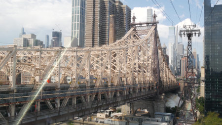 New York City Roosevelt Island tramway to Manhattan Midtown streets. American cable tram near Queensboro Bridge. Urban public transport in USA. Upper east side building architecture, skyline cityscapeの写真素材