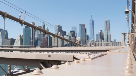 Brooklyn Bridge to Manhattan downtown. New York City skyline, financial district cityscape. World...