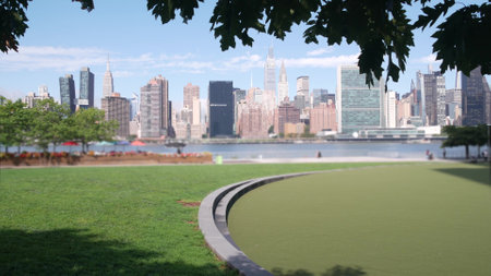 New York City waterfront skyline, Manhattan Midtown buildings, riverfront skyscrapers by East river water. Waterside cityscape view from Hunters Point, Long Island, Queens. United States architecture.の写真素材