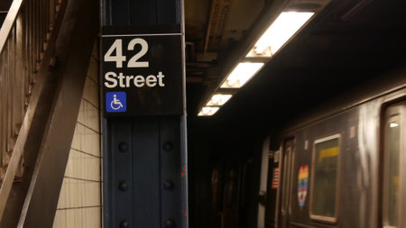 New York City subway station interior, underground metropolitan platform sign. Metro railway passenger train, public transport, United States. Text signboard 42 st. Grand Central Terminal, Manhattan.の写真素材