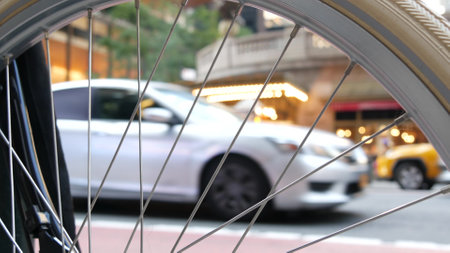 New York City Grand Central Terminal railway station, 42 street. Manhattan Midtown. Yellow taxi cabs, car transport on Pershing Square, NYC, USA. American urban road traffic, people thru bike wheel.の写真素材