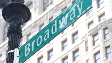 Broadway street road sign, Manhattan midtown district architecture, New York City corner. Traffic signage. Flatiron Building near Madison Square Park. Crossroad of 23 street, Bway and 5 Fifth avenue.の写真素材