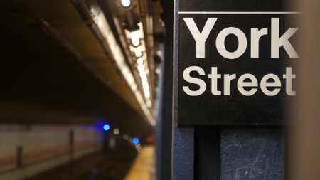 New York City empty subway station interior, underground metropolitan platform sign. Metro railway passenger public transport, United States. Perspective. Text signboard York Street. Brooklyn Downtownの写真素材