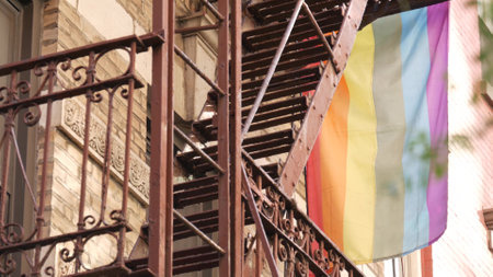 New York City building architecture, Manhattan USA. Urban residential house exterior. LGBT rainbow...