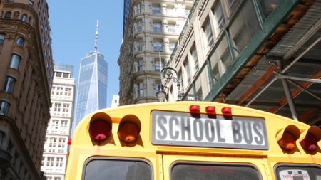 Yellow School Bus. Schoolbus back view on Fulton street, New York City Manhattan Downtown. Children education and transportation, USA. American school shuttle, World Trade Center tower, United States.のeditorial素材