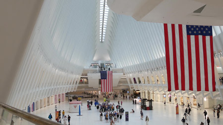New York City, United States - 10 Sept 2023: World Trade Center Oculus transport hub architecture. Manhattan Downtown Financial District, USA urban life. People. September 11 remembrance american flagのeditorial素材
