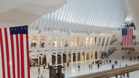 New York City, United States - 10 Sept 2023: World Trade Center Oculus transport hub architecture. Manhattan Downtown Financial District, USA urban life. People. September 11 remembrance american flagのeditorial素材