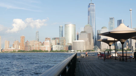 New York City, United States - 12 Sept 2023: Waterfront skyline, Manhattan Downtown Financial district, World Trade Center building, riverfront skyscrapers. From J Owen Grundy Park, New Jersey. Peopleのeditorial素材