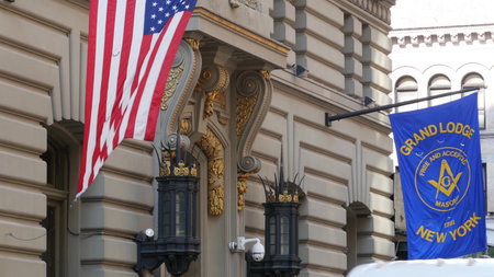New York City, United States - 6 Sept 2023: Grand Lodge of Masons building facade, Manhattan street. Freemasons headquarters architecture. Masonry organization in NYC, USA. Masonic Hall exterior. Flagのeditorial素材