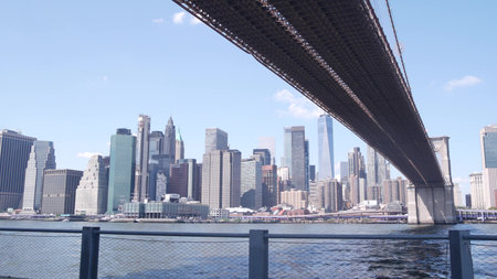 New York City, United States - 30 Aug 2023: Brooklyn Bridge, Manhattan downtown skyline, financial district waterfront cityscape. World Trade Center, WTC skyscraper. Dumbo riverfront, East river.のeditorial素材