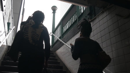 New York City, United States - 30 Aug 2023: Underground subway, metro stairway. Empire State building. Metropolitan entrance. Manhattan Midtown financial business district. African american man woman.のeditorial素材