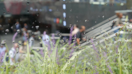 New York City, United States - 11 Sept 2023: Manhattan Midtown Lexington avenue, United States. Defocused people pedestrian, underground metro subway station, stairs on 53 street, urban USA. Greenery.のeditorial素材