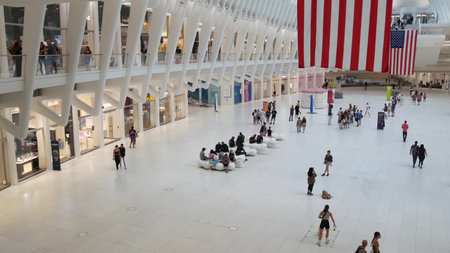New York City, United States - 10 Sept 2023: World Trade Center Oculus transport hub architecture. Manhattan Downtown Financial District, USA urban life. People. September 11 remembrance american flagのeditorial素材