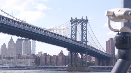 New York City, United States - 30 Aug 2023: Manhattan Bridge lookout, tower viewer binoculars, Brooklyn Dumbo. Waterfront downtown cityscape, skyscraper skyline. East River tourist promenade.のeditorial素材
